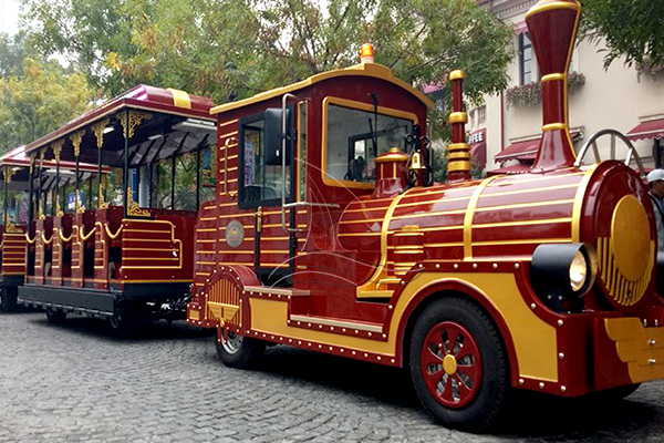 Red antique diesel tourist train rides