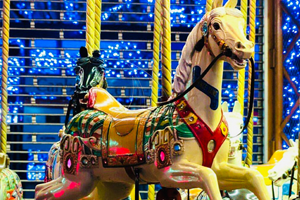 details of the seat of outdoor christmas carousel