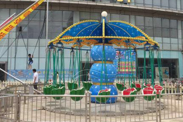 fruit swing ride in front of mall