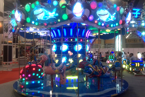 Sea carousel with LED lights at night